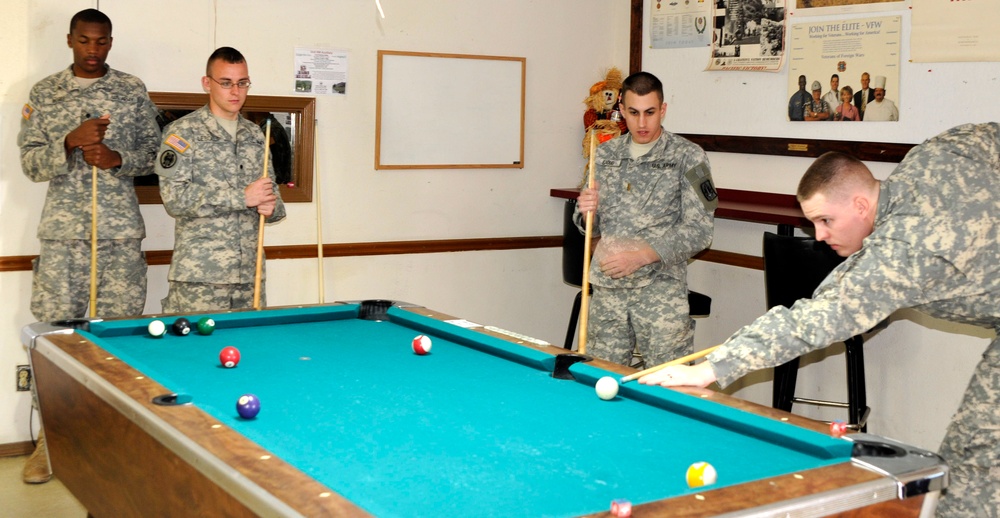 Soldiers relax with a game of pool