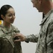 Newly promoted sergeant first class pins rank at Camp Buehring