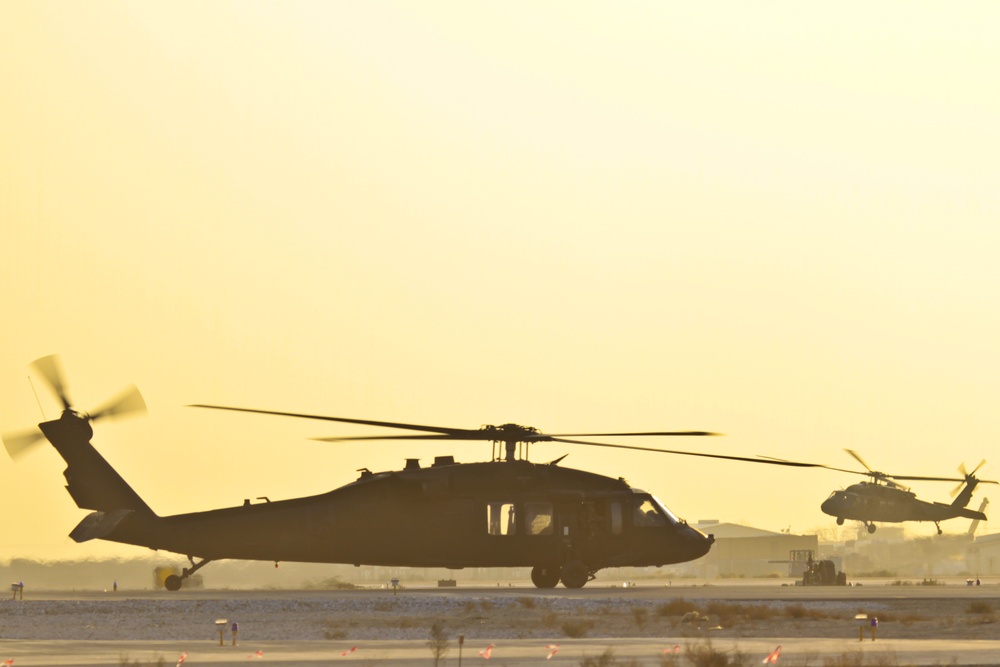 Blackhawks taxi at sunset