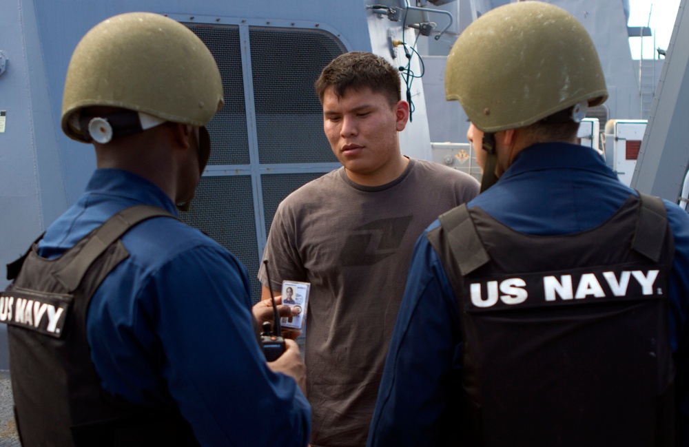 Suspicious Marines support sailors during protection drill