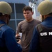 Suspicious Marines support sailors during protection drill