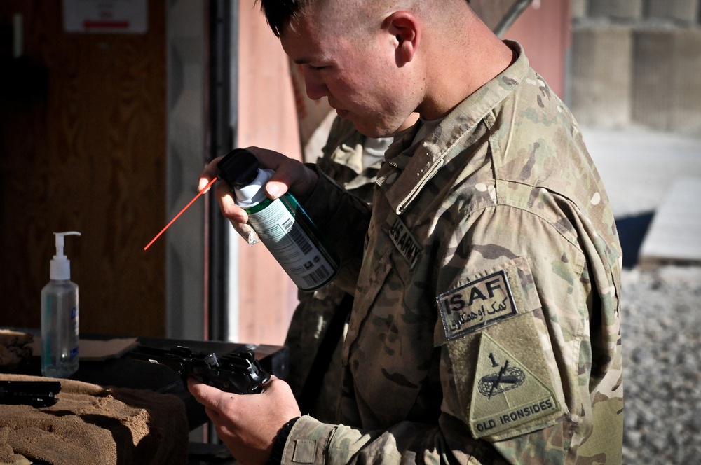 Bravo Company soldiers maintain arms and equipment