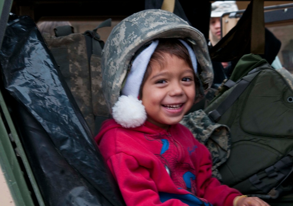 341st Psychological Operations Company soldiers give toys to children