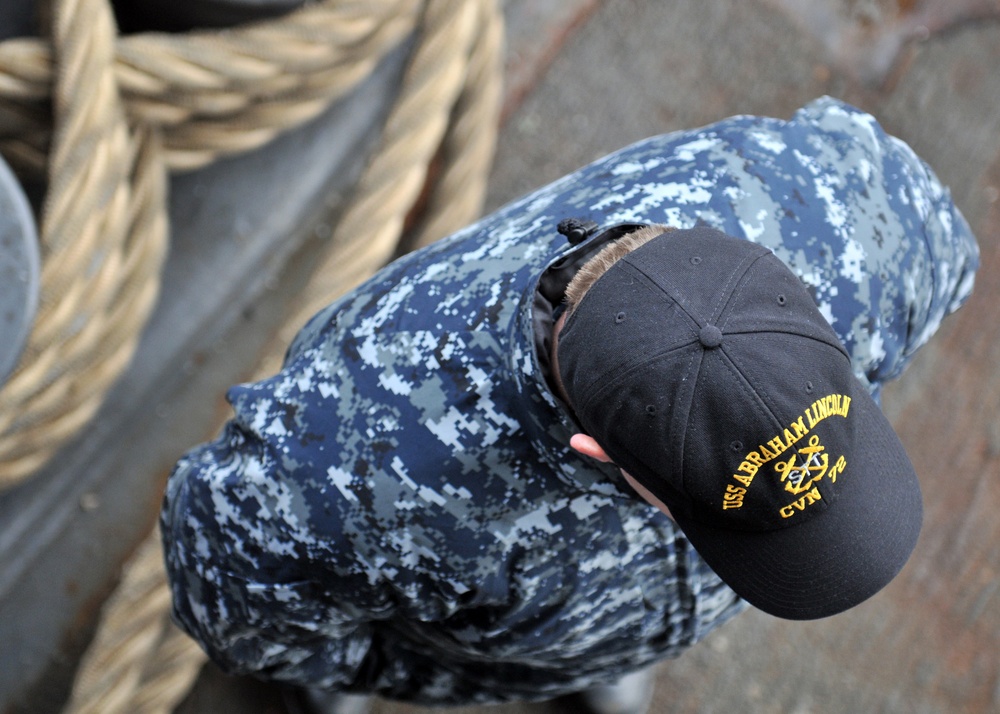 Line handling operations aboard USS Abraham Lincoln