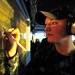 USS Enterprise sailor updates status board