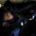 USS Anzio sailor inspects landing gear