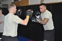 Soldiers engage in combatives training
