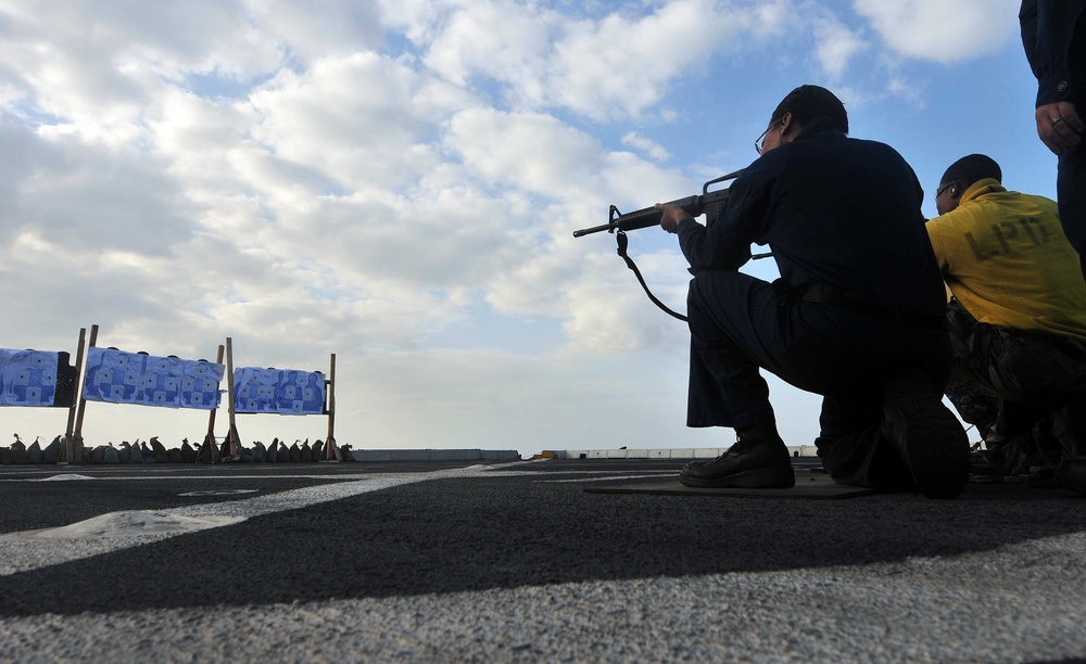 Sailors participate in live-fire qualification aboard USS Mesa Verde