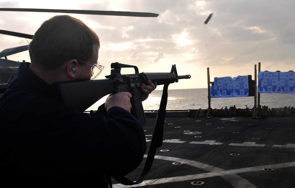Sailors participate in live-fire qualification aboard USS Mesa Verde