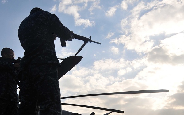 Sailors participate in live-fire qualification aboard USS Mesa Verde