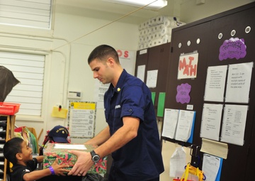Coast Guard delivers 350 gifts to local elementary school