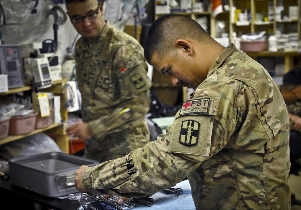 Soldier helps surgeons operate at Forward Operating Base Shank