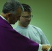 Serving the masses: priest no stranger to transitions