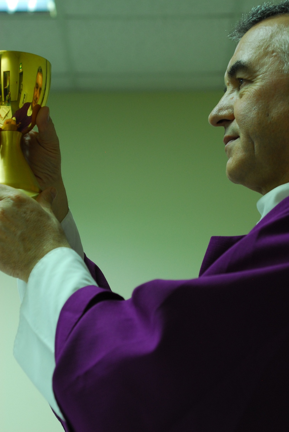Serving the masses: priest no stranger to transitions