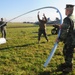 Combat Service Support Detachment Seabees take apart a metal frame