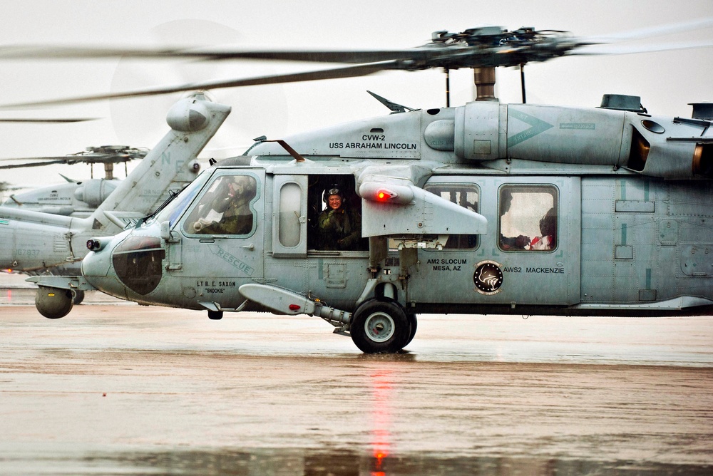 Naval air crewman waves to her family