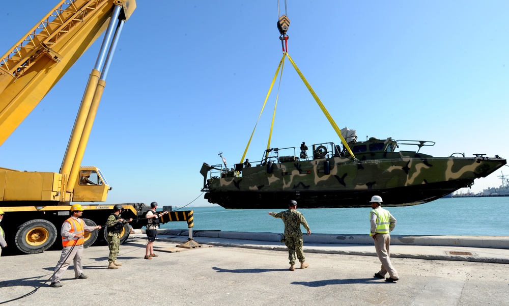 Riverine Squadron Two detachment from Little Creek, Va., launches two Riverine Command Boats after a move to Bahrain.