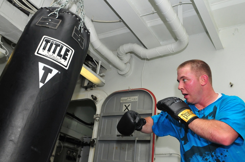 USS Carl Vinson sailor boxes in gym