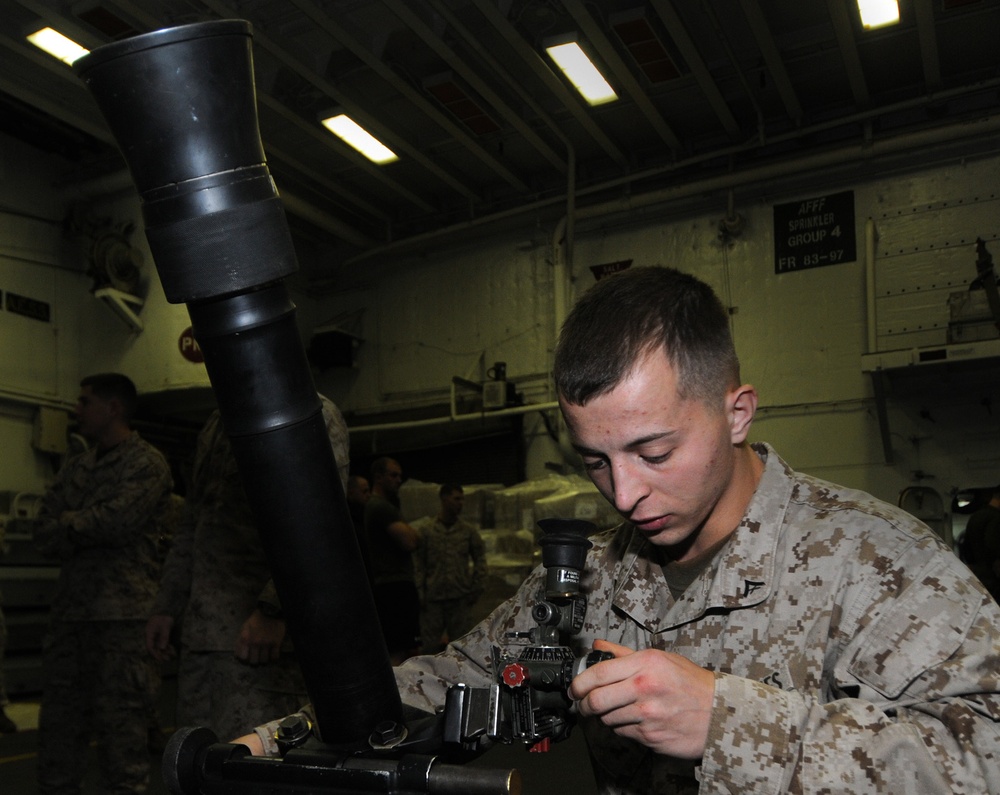 Marine performs mortar drills aboard USS Bataan