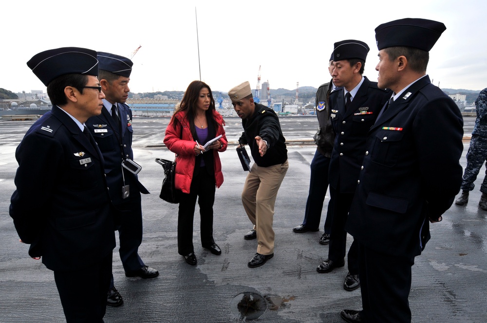 Sailor explains flight operations to Japanese officers