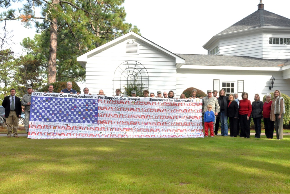 Colonial Cup flag signed for troops overseas