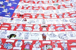 Colonial Cup flag signed for troops overseas