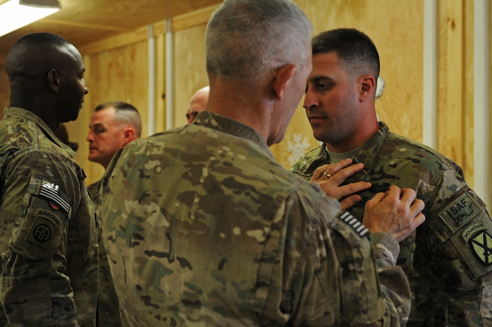 Soldier receives combat action badge on Christmas