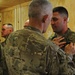 Soldier receives combat action badge on Christmas
