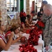 Cheerleaders sign autographs