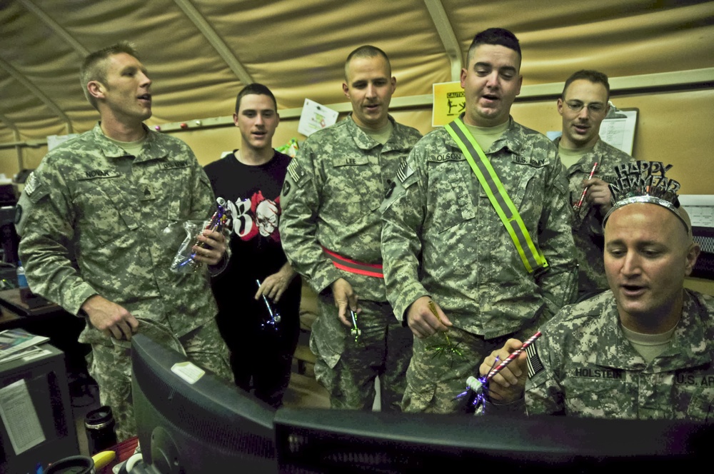 1/34th BCT S6 soldiers take a pause in nightly operations to ring in 2012
