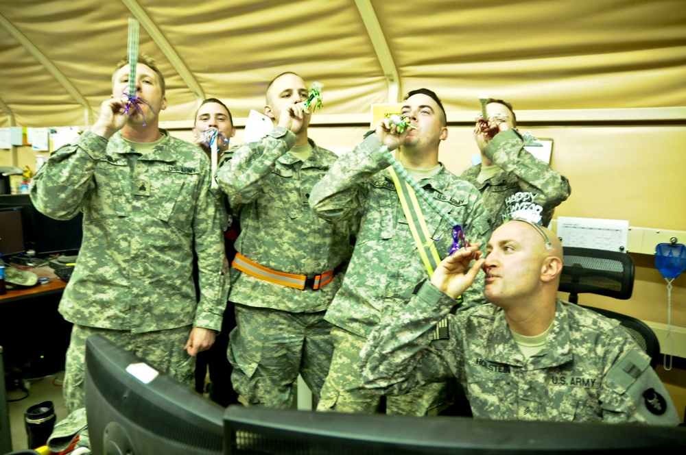 1/34th BCT S6 soldiers pause to ring in 2012