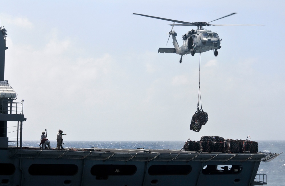 USNS Bridge vertical replenishment at sea with USS Carl Vinson