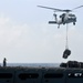 USNS Bridge vertical replenishment at sea with USS Carl Vinson