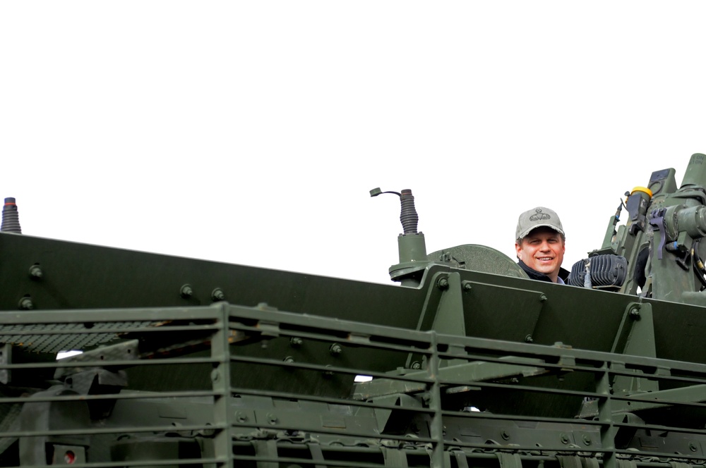 Michigan Representative Huizenga enjoys the view from the top of a Stryker in Regional Command (South)