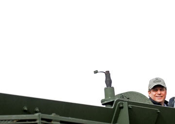 Michigan Representative Huizenga enjoys the view from the top of a Stryker in Regional Command (South)