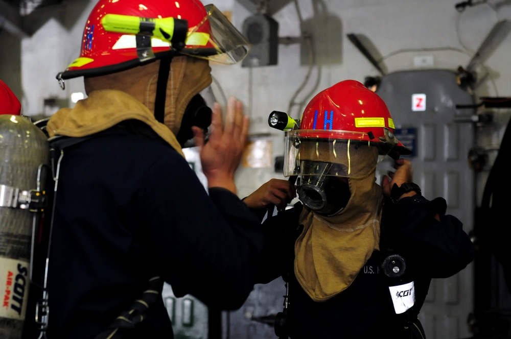 USS Abraham Lincoln sailors prepare for fire drill