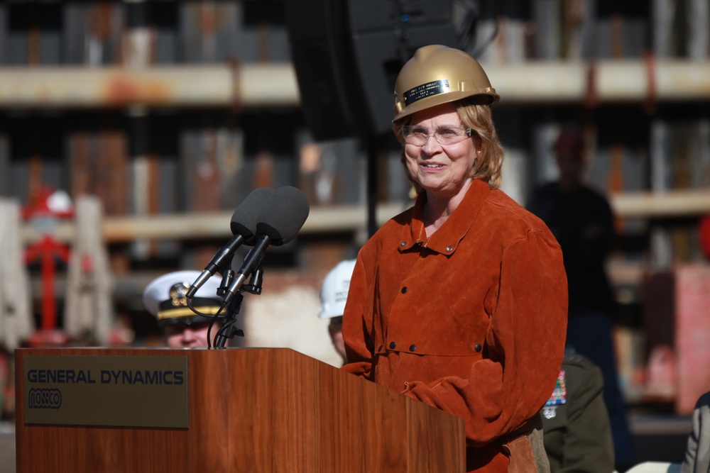 Honorary guest Pat Mills speaks at a Keel Laying Ceremony