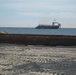 Hopper dredge pumping sand