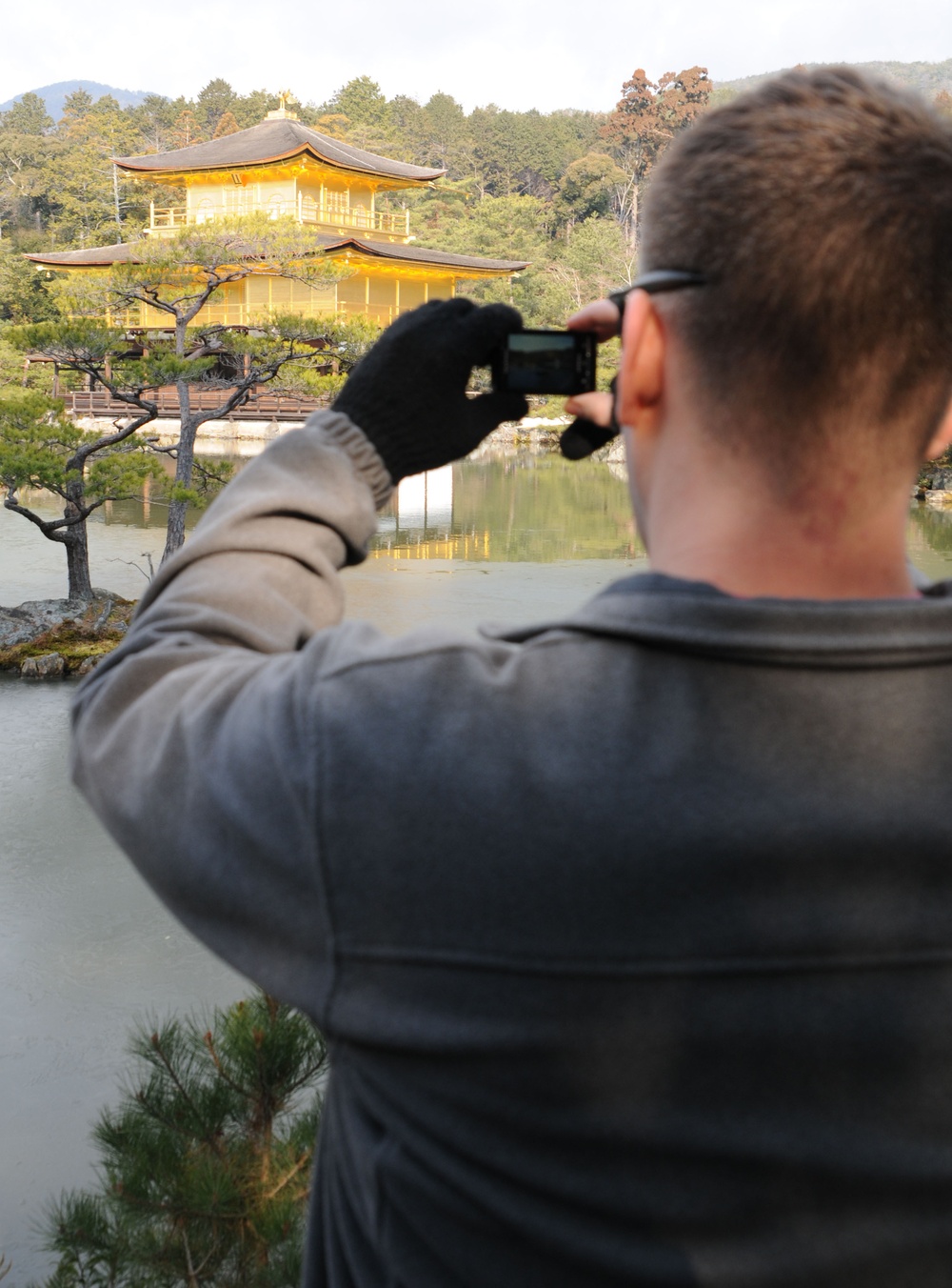 Military personnel visit the Golden Pavilion