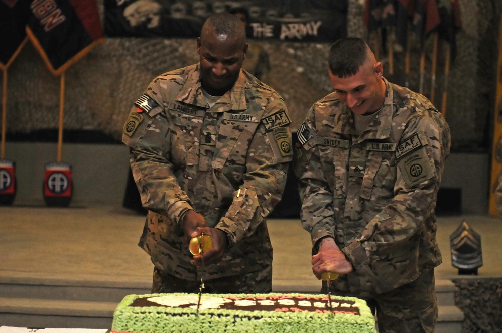 Command Sgt. Maj. Lambert, newly inducted NCO cut cake at NCO induction ceremony