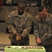 Command Sgt. Maj. Lambert, newly inducted NCO cut cake at NCO induction ceremony