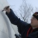 Navy Misawa snow sculpture team begins work on "The Lone Sailor" sculpture
