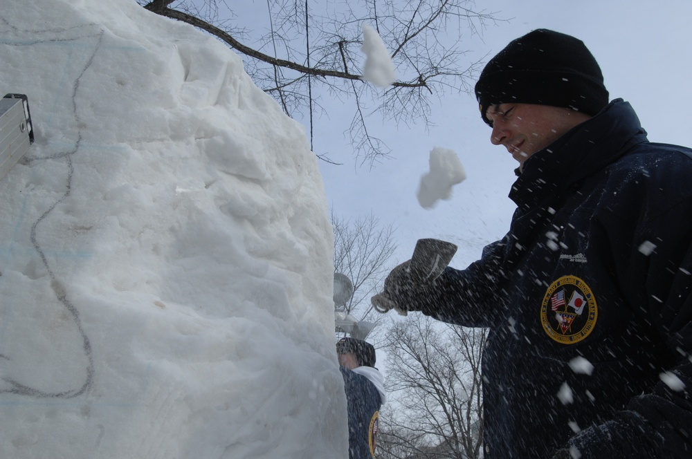 Navy Misawa snow sculpture team begins shaping &quot;The Lone Sailor&quot;