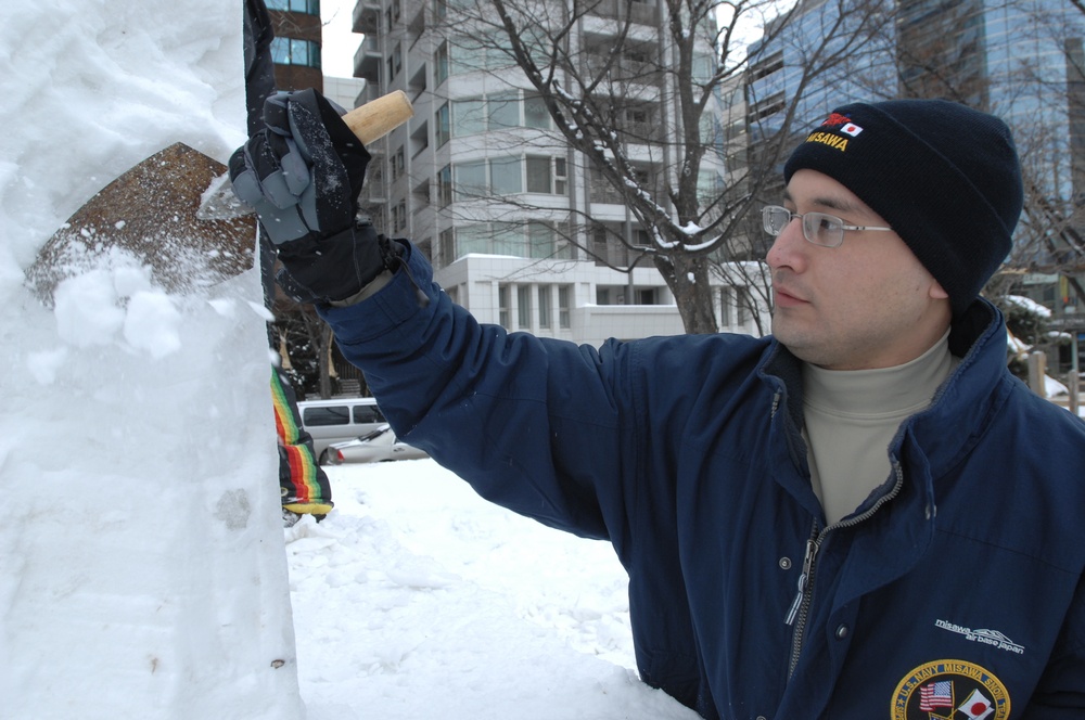 Navy Misawa snow sculpture team begins shaping 'The Lone Sailor'