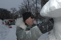 Navy Misawa sailors building 'Lone Sailor' snow sculpture
