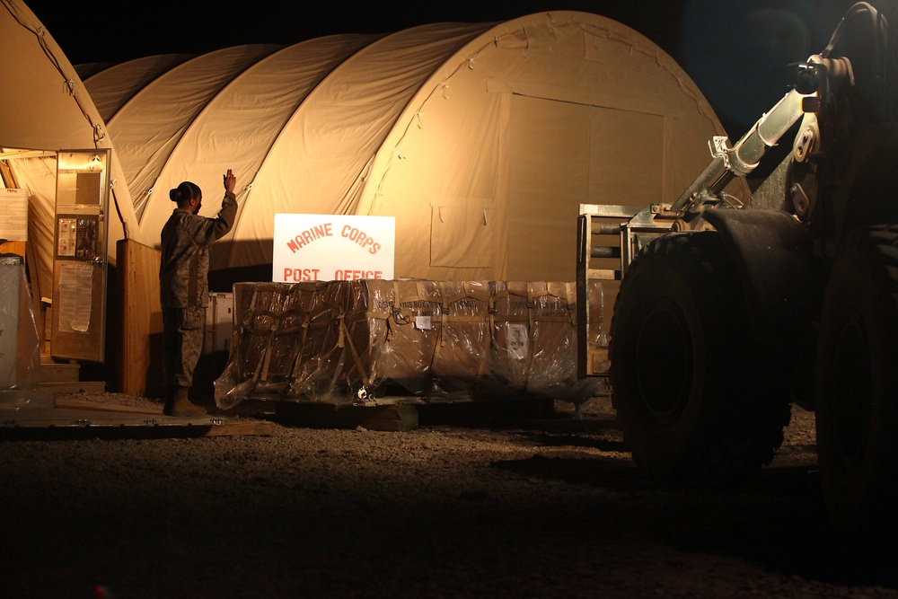 Rain, snow, dead of night finds postal Marines working