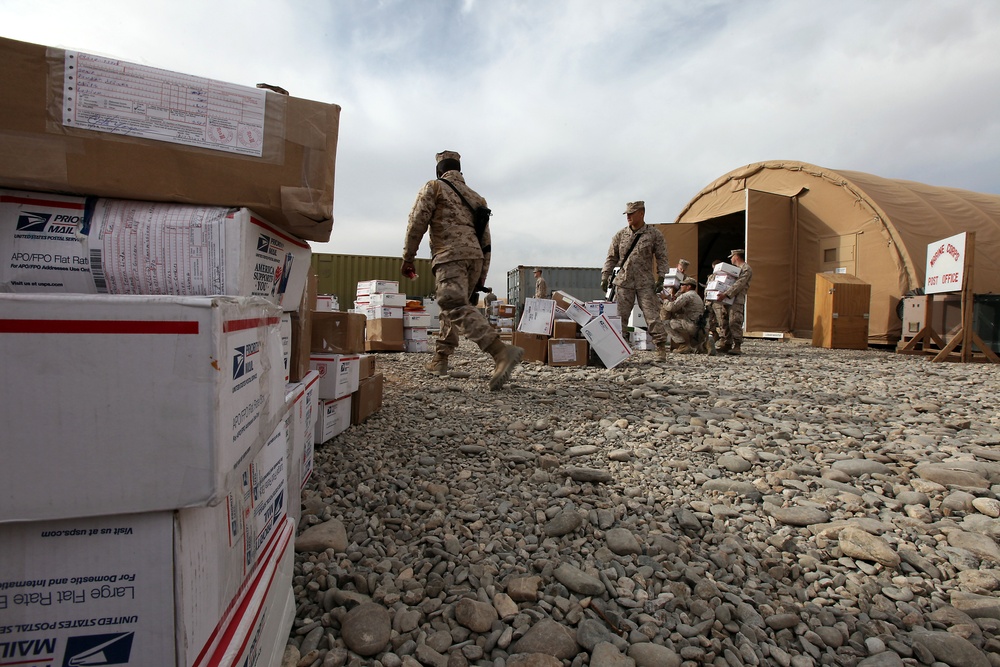 Rain, snow, dead of night finds postal Marines working
