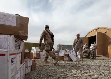 Rain, snow, dead of night finds postal Marines working