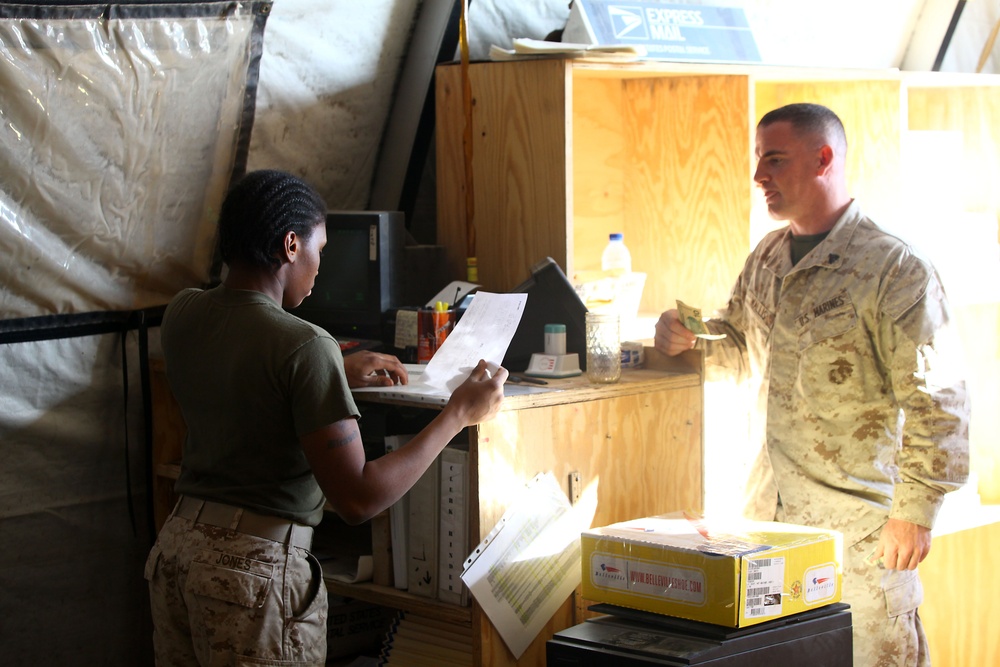 Rain, snow, dead of night finds postal Marines working