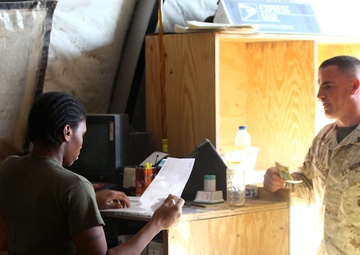 Rain, snow, dead of night finds postal Marines working